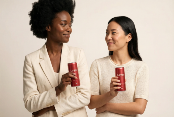 Layer founders holding Layer cans